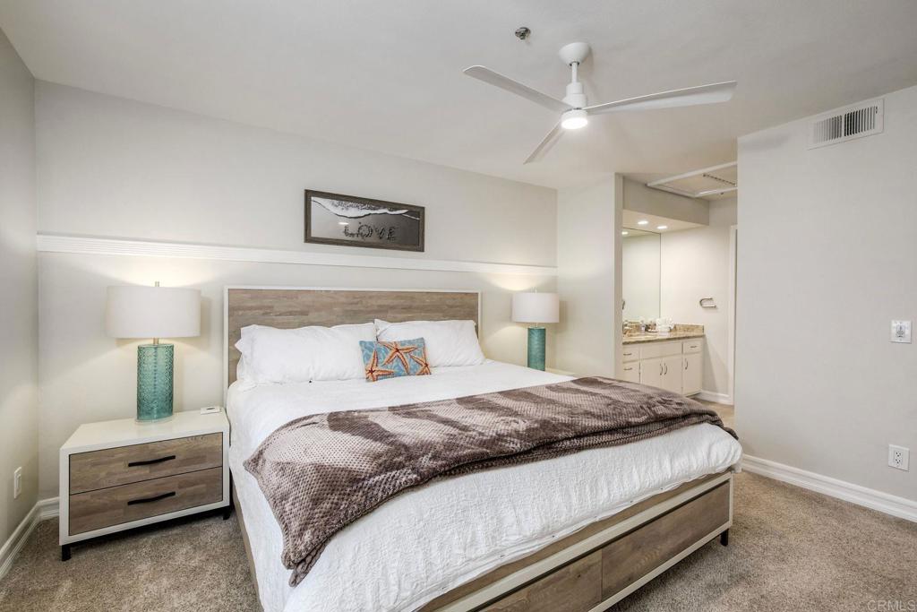 400 North Pacific Street, Unit 314 Oceanside, CA 92054 - Photo 9 of 20 a bedroom with a bed and a view of bathroom