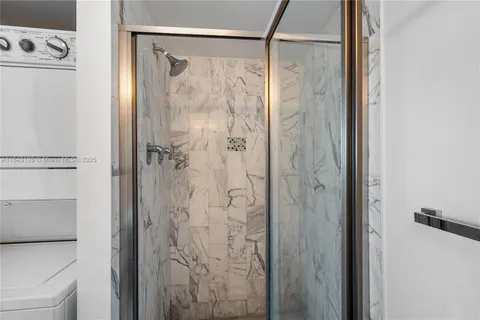 a bathroom with a shower and a tub