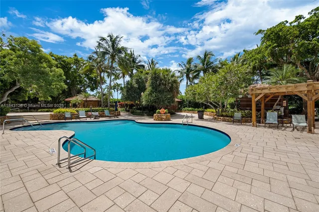 a view of swimming pool with chairs