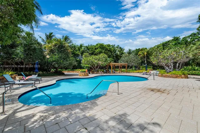 a view of swimming pool with lounge chair
