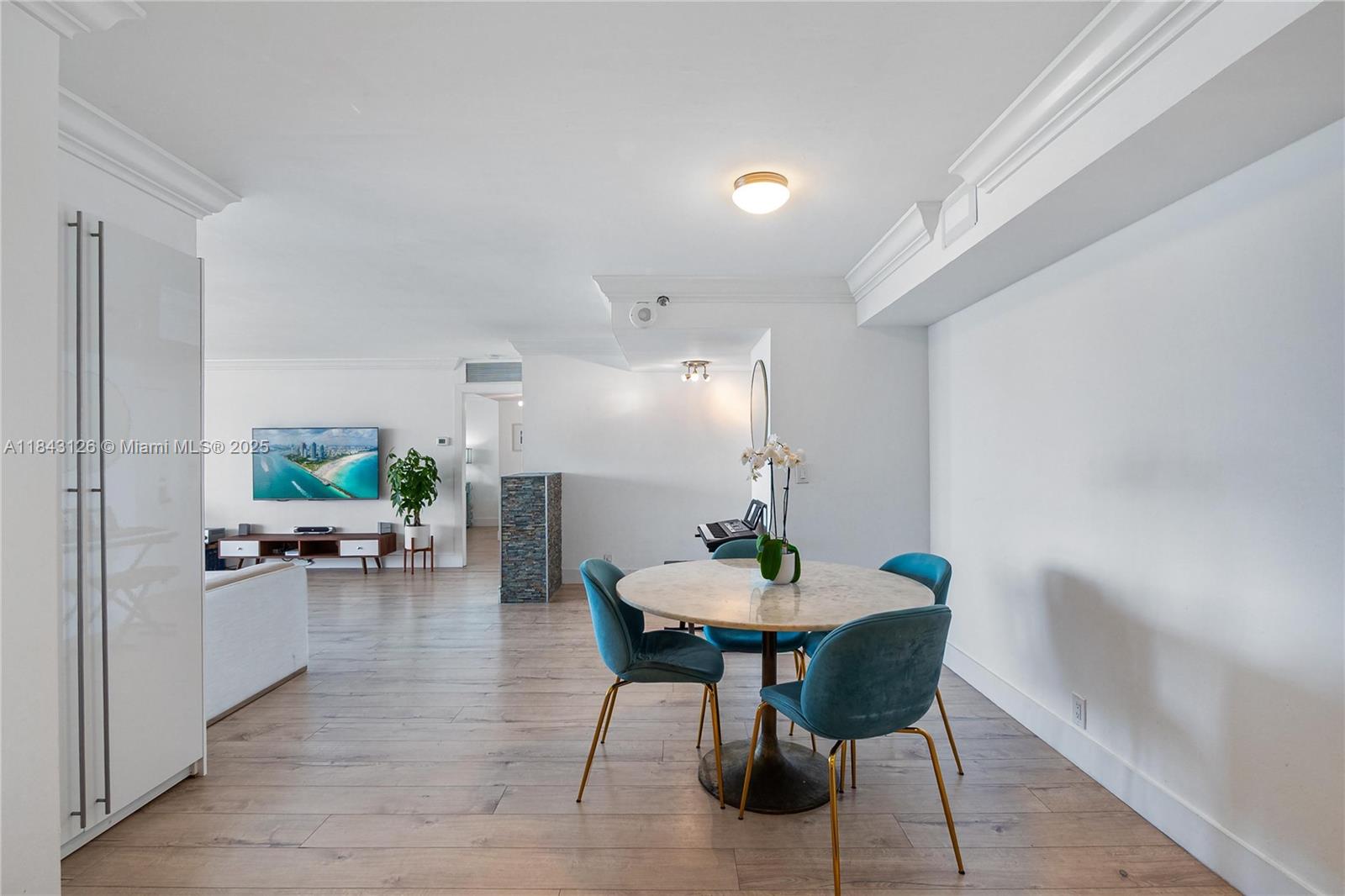 2000 Towerside Terrace, Unit PH9 Miami, FL 33138 - Photo 5 of 40 a view of a dining room with furniture and wooden floor