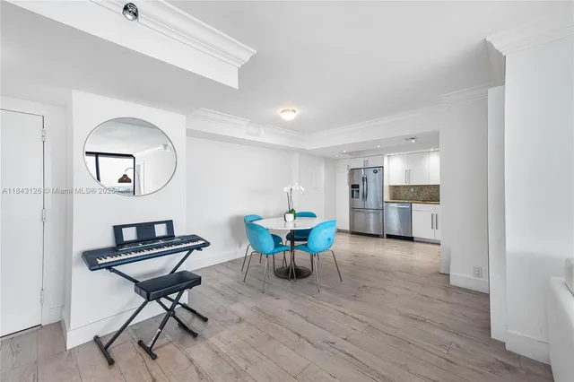 a view of a livingroom with furniture and a table wooden floor