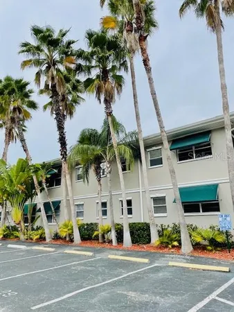 a view of street along with palm trees