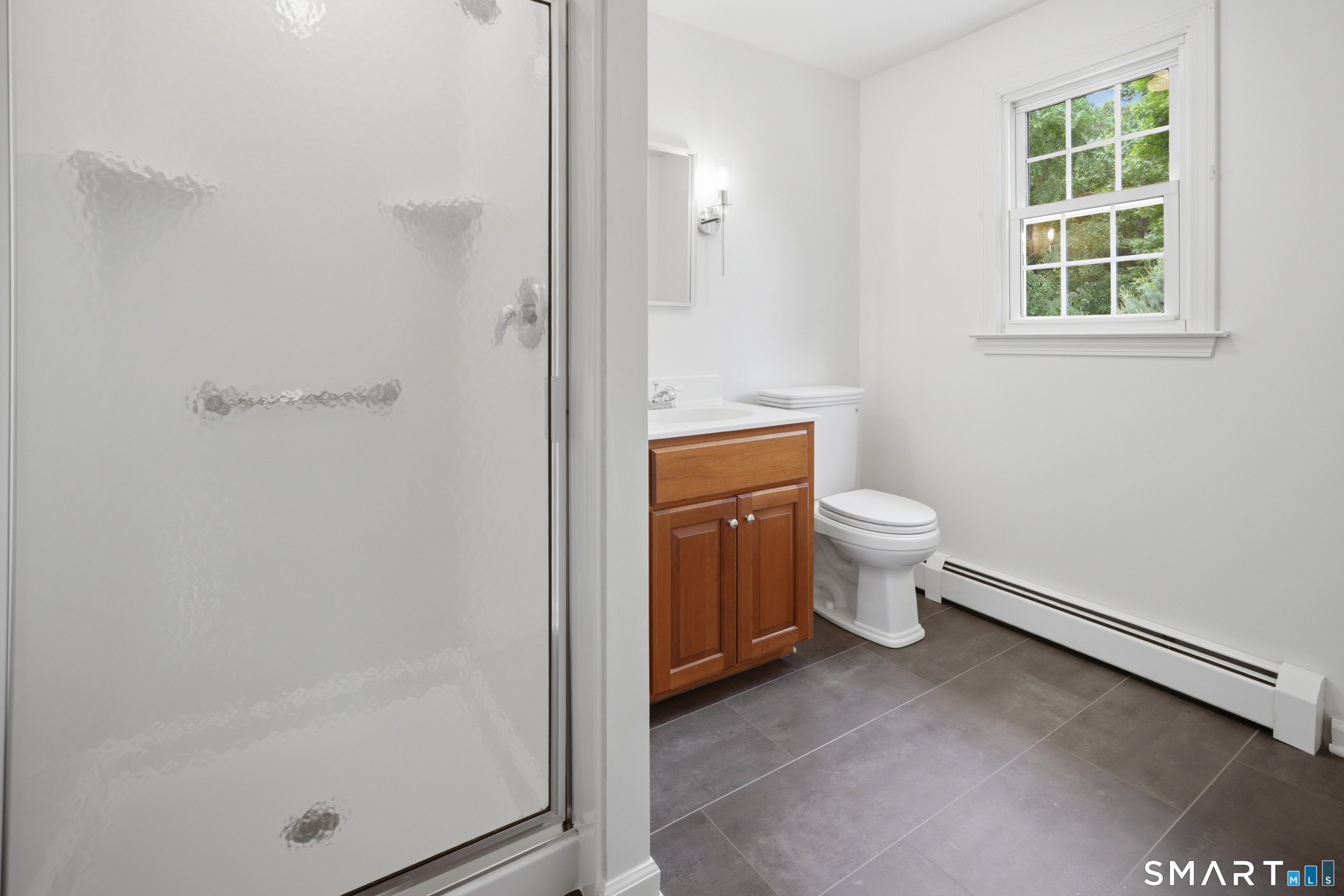 211 Valley View Road Manchester, CT 06040 - Photo 25 of 39 a bathroom with a toilet and a shower