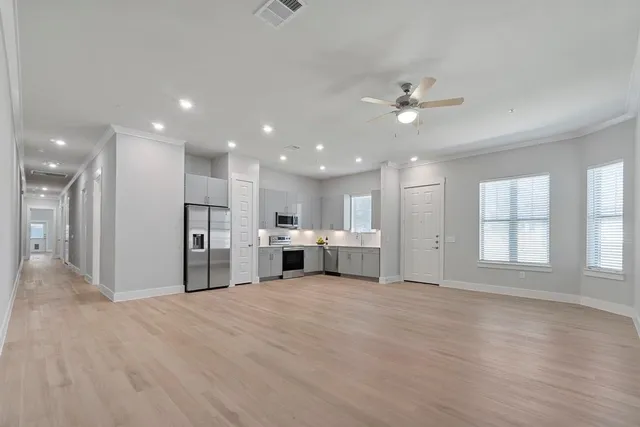 a view of a kitchen with a sink and a window