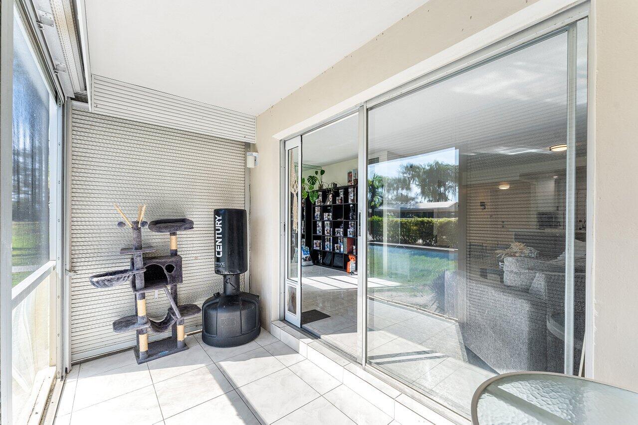 5701 Northwest 2nd Avenue Boca Raton, FL 33487 - Photo 19 of 26 a room with lot of furniture and a chandelier