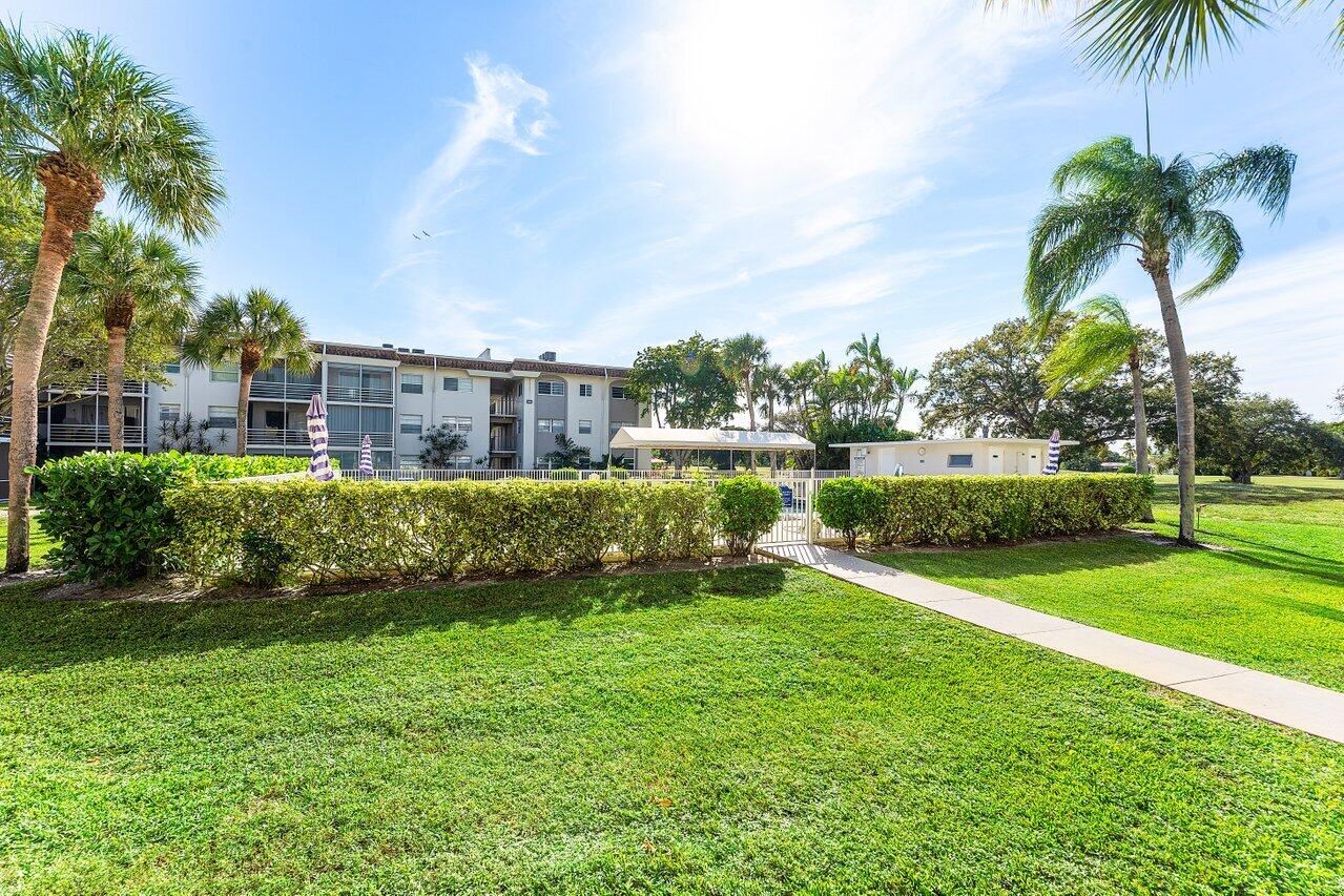 5701 Northwest 2nd Avenue Boca Raton, FL 33487 - Photo 26 of 26 a view of a garden with a building in the background