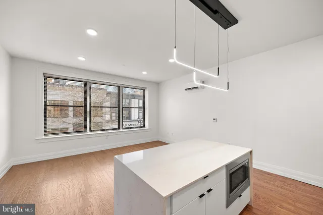 a view of a hallway with washer and dryer