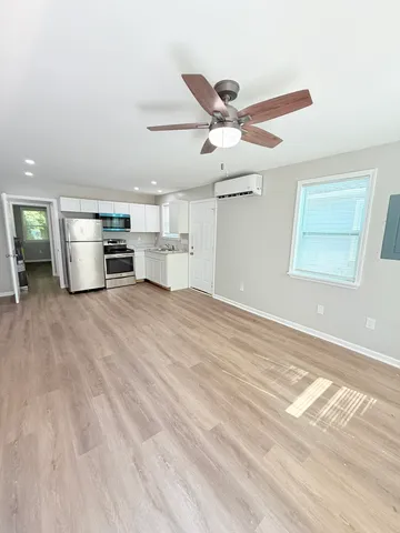 a view of a kitchen with a sink and a window