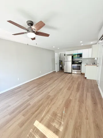 a view of a kitchen with a sink and dishwasher