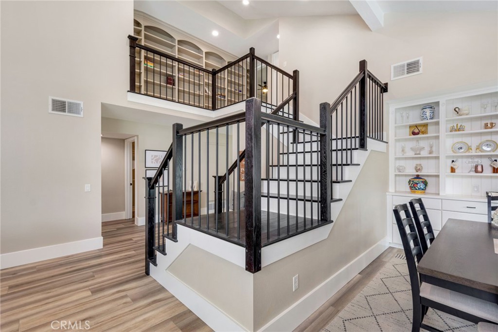 109 Cinnamon Ridge Road Brea, CA 92821 - Photo 11 of 67 New stairs (treads and banister) leading to upstairs including built in shelves at top of stairs.