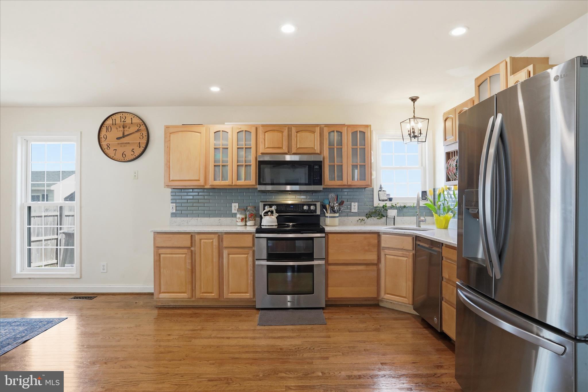 1130 Happy Ridge Drive Front Royal, VA 22630 - Photo 11 of 42 a kitchen with stainless steel appliances granite countertop a refrigerator oven a stove and a sink