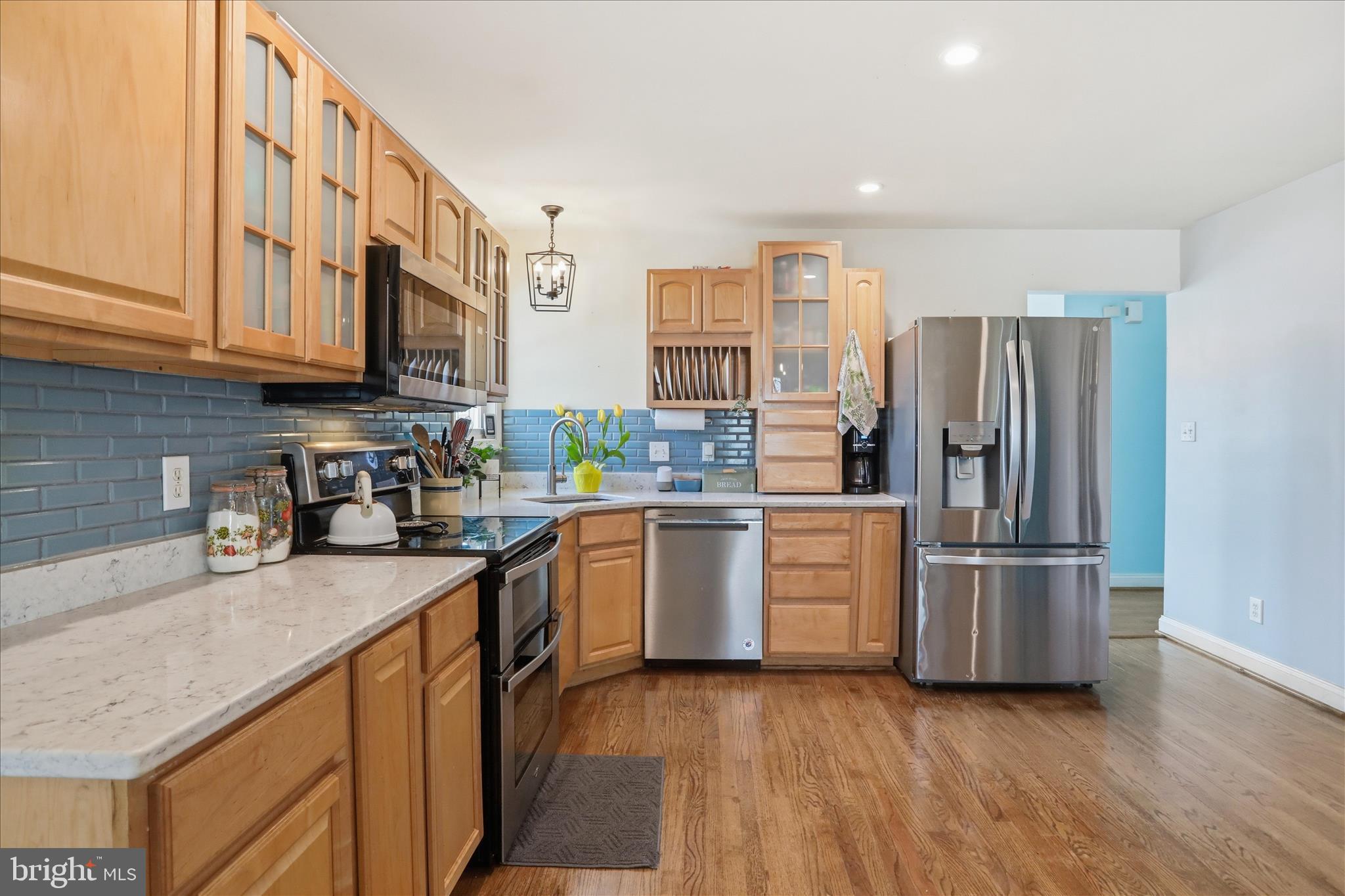 1130 Happy Ridge Drive Front Royal, VA 22630 - Photo 13 of 42 a kitchen with stainless steel appliances granite countertop a refrigerator sink and microwave