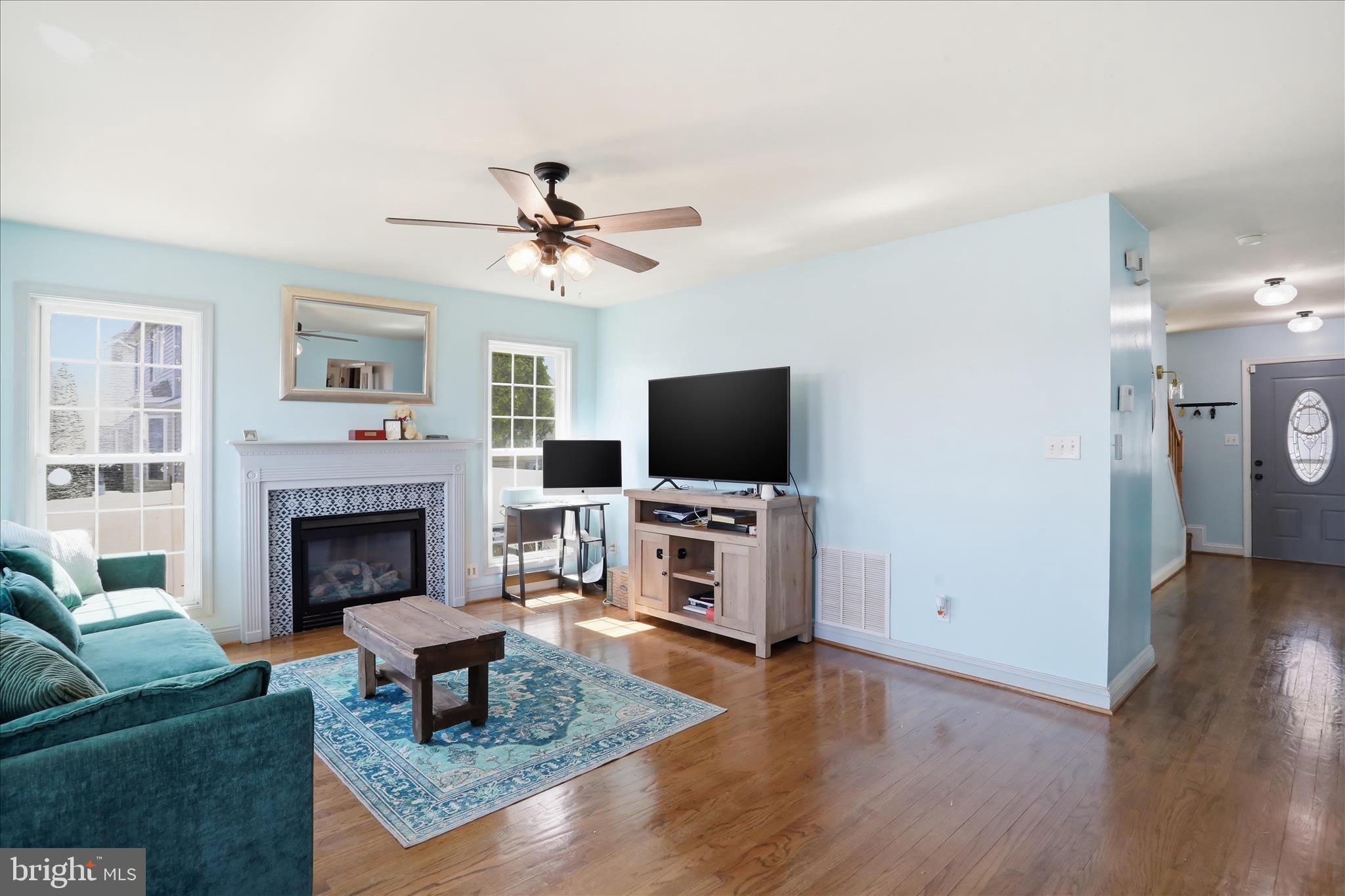 1130 Happy Ridge Drive Front Royal, VA 22630 - Photo 9 of 42 a living room with furniture a fireplace and a flat screen tv