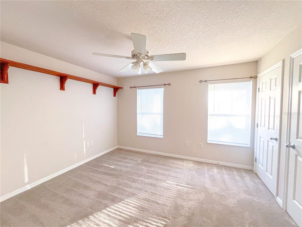 2306 Southwest 42nd Drive, Unit 144 Gainesville, FL 32607 - Photo 9 of 11 a view of an empty room with a window