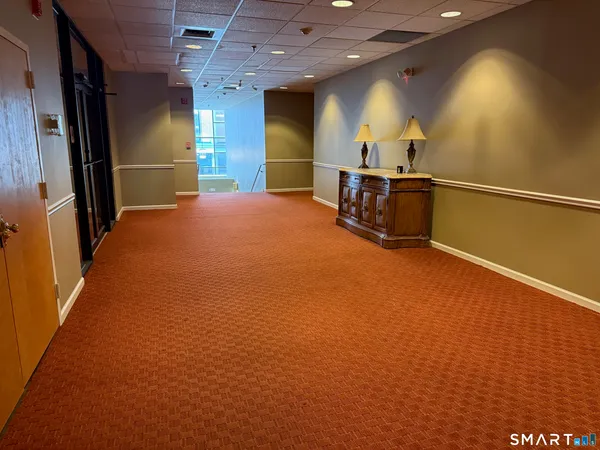 a view of an empty room with a fireplace