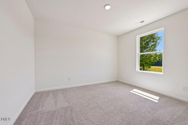 10955 Lancaster Store Road Castalia, NC 27816 - Photo 9 of 20 an empty room with windows