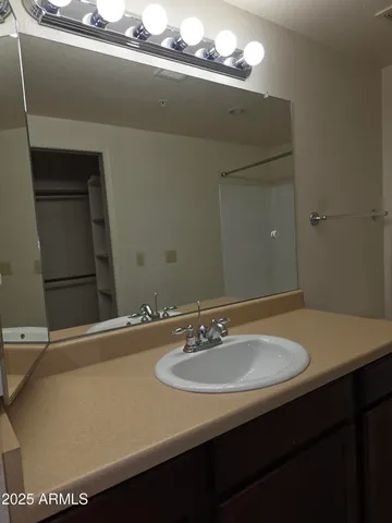 a bathroom with a sink and a mirror