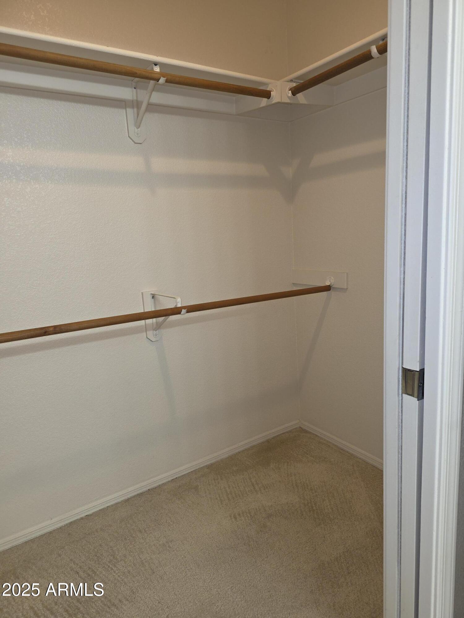 750 East Northern Avenue, Unit 1052 Phoenix, AZ 85020 - Photo 13 of 15 a view of a room with racks on the wall