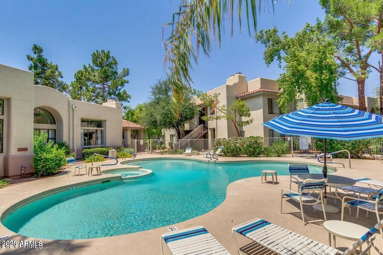 750 East Northern Avenue, Unit 1052 Phoenix, AZ 85020 - Photo 3 of 15 a view of a house with backyard sitting area and furniture