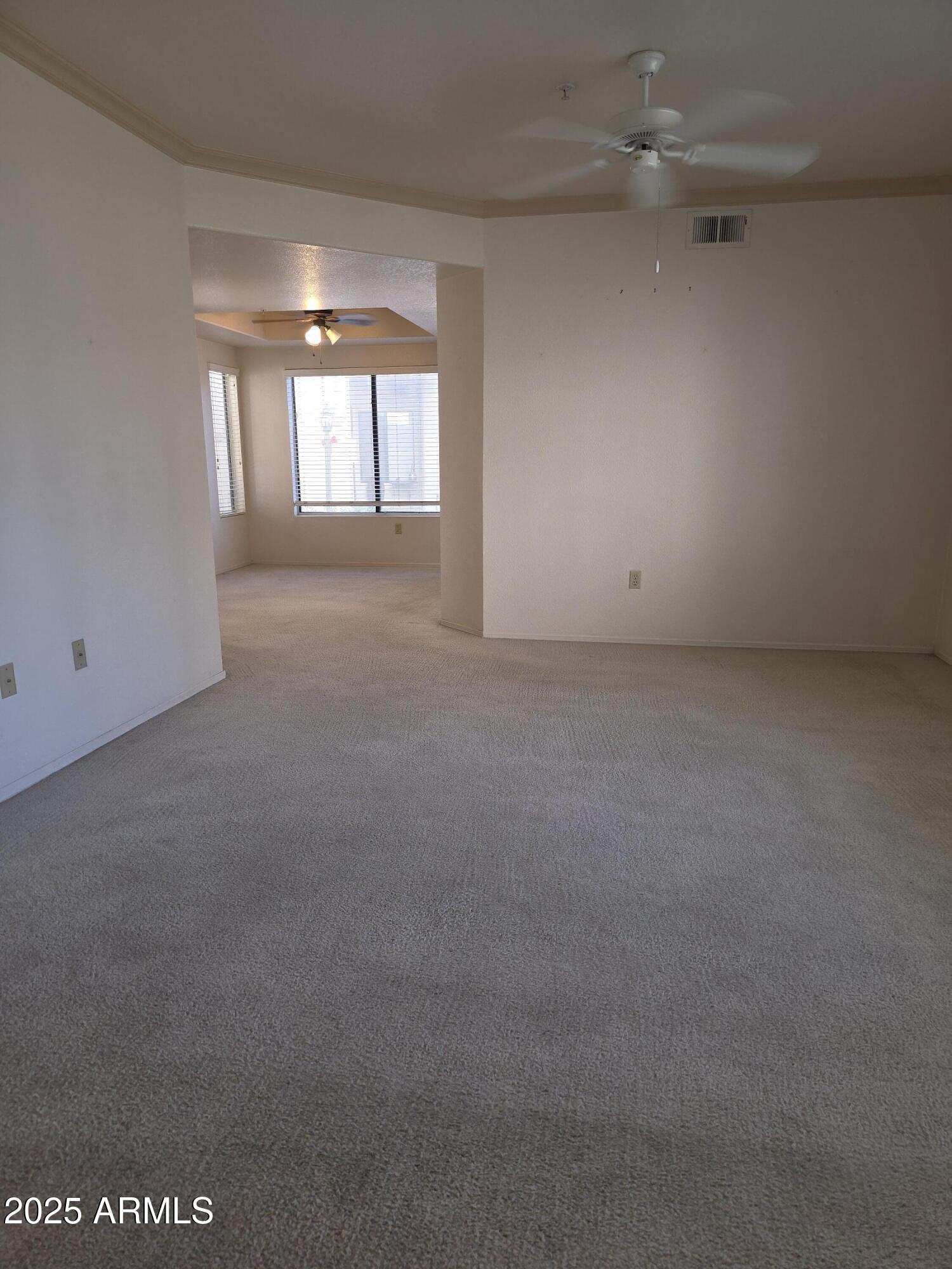 750 East Northern Avenue, Unit 1052 Phoenix, AZ 85020 - Photo 7 of 15 an empty room with windows and closet