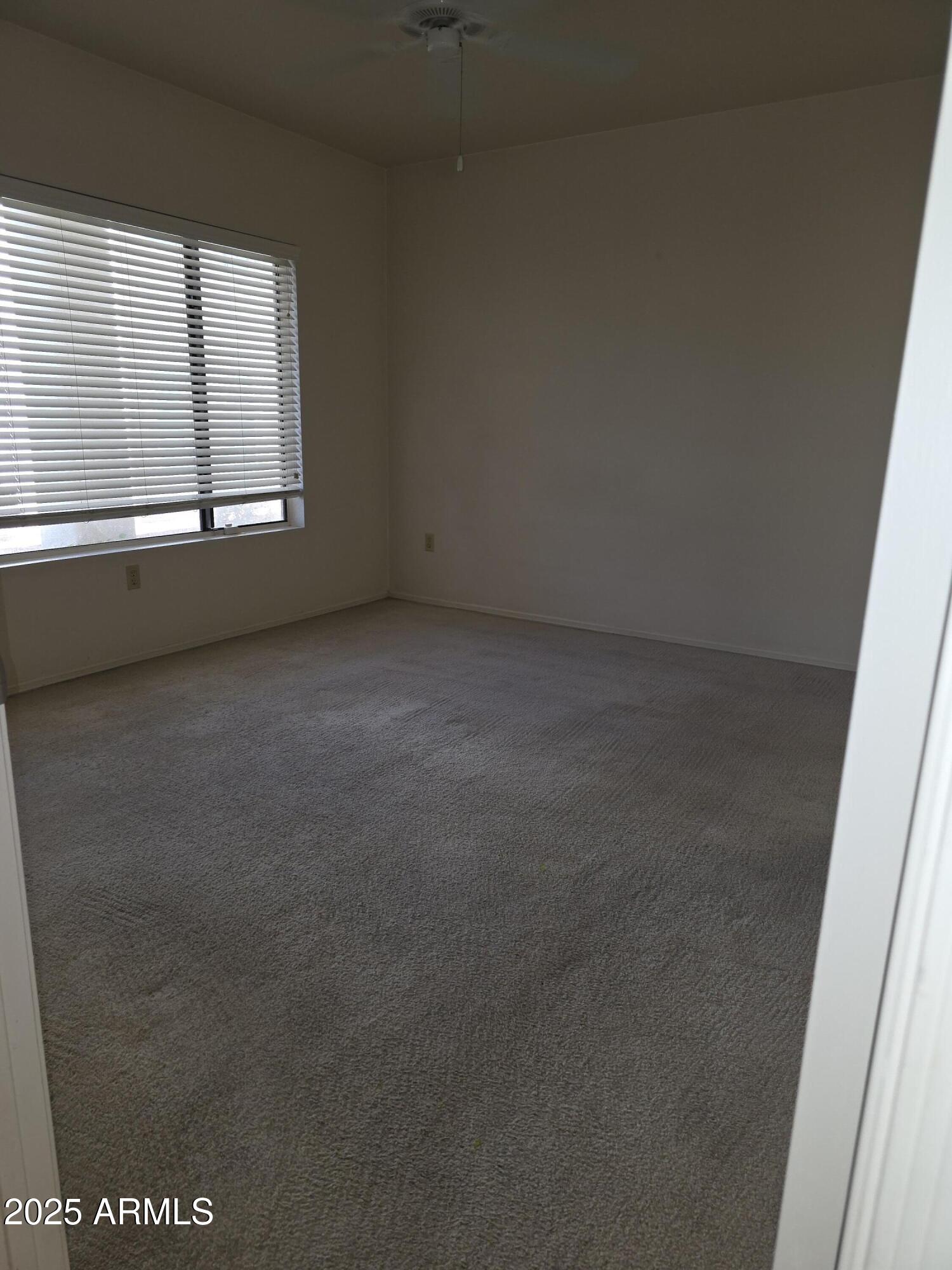 750 East Northern Avenue, Unit 1052 Phoenix, AZ 85020 - Photo 10 of 15 a view of an empty room with a window