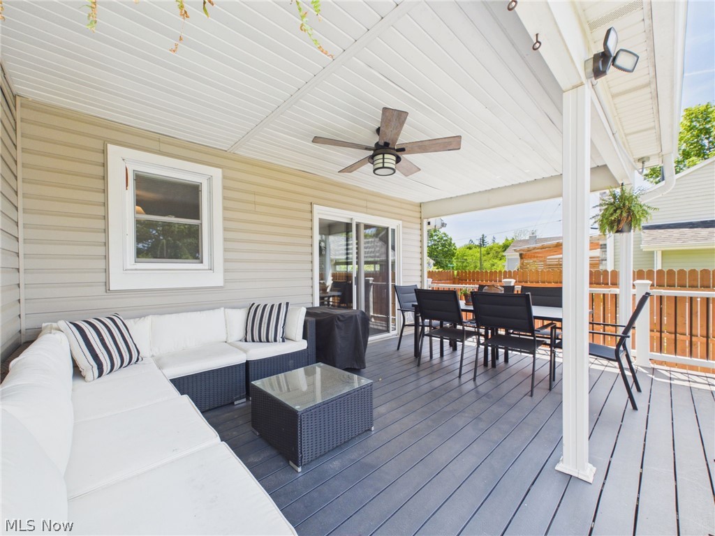 3490 County Line Road Madison, OH 44057 - Photo 9 of 42 Covered deck with dark wood-finish flooring, white vinyl ceiling, and a ceiling fan