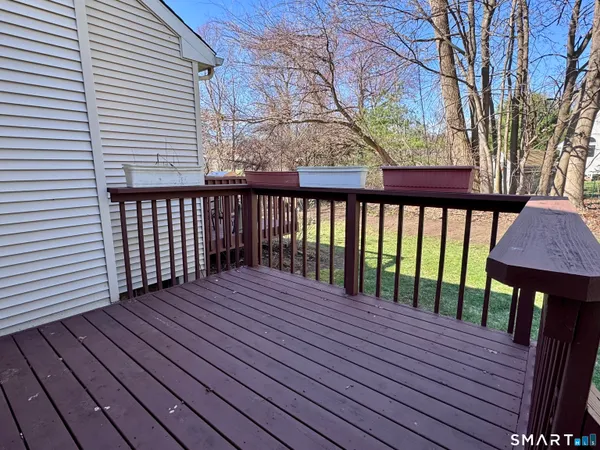 a view of a backyard with wooden fence