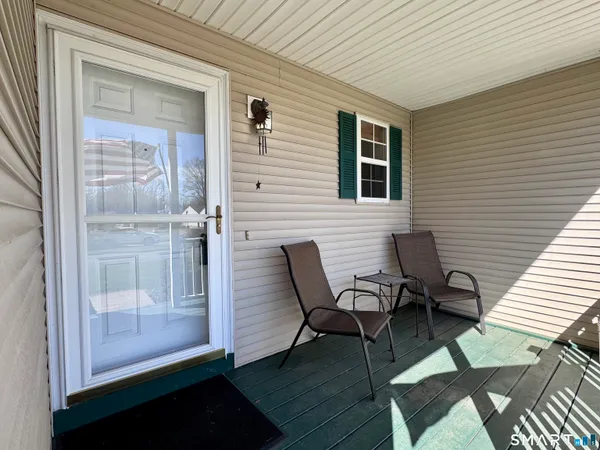 a view of a patio with chair and table