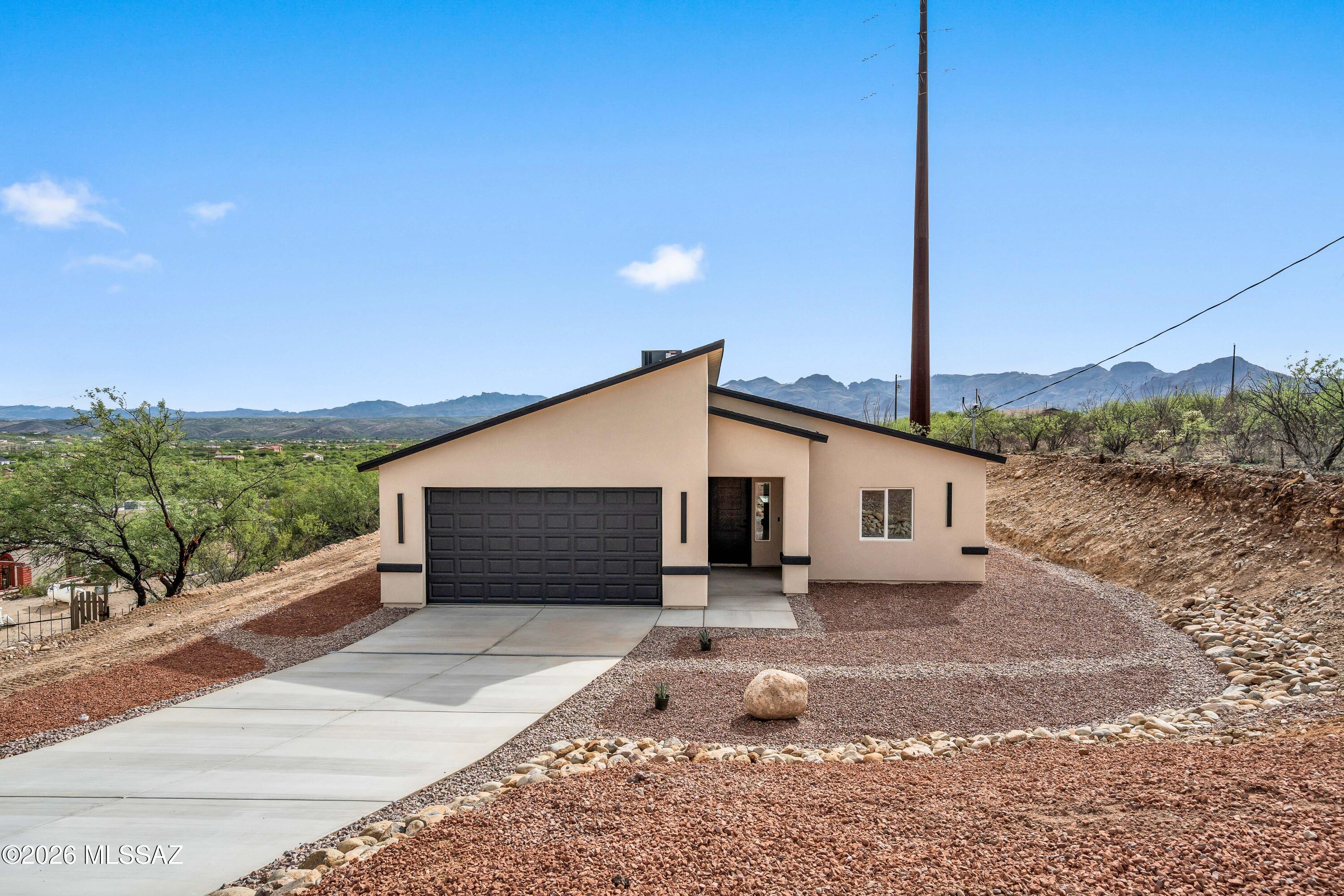 1834 Circulo Glorieta Rio Rico, AZ 85648 - Photo 2 of 35 a front view of a house with a yard