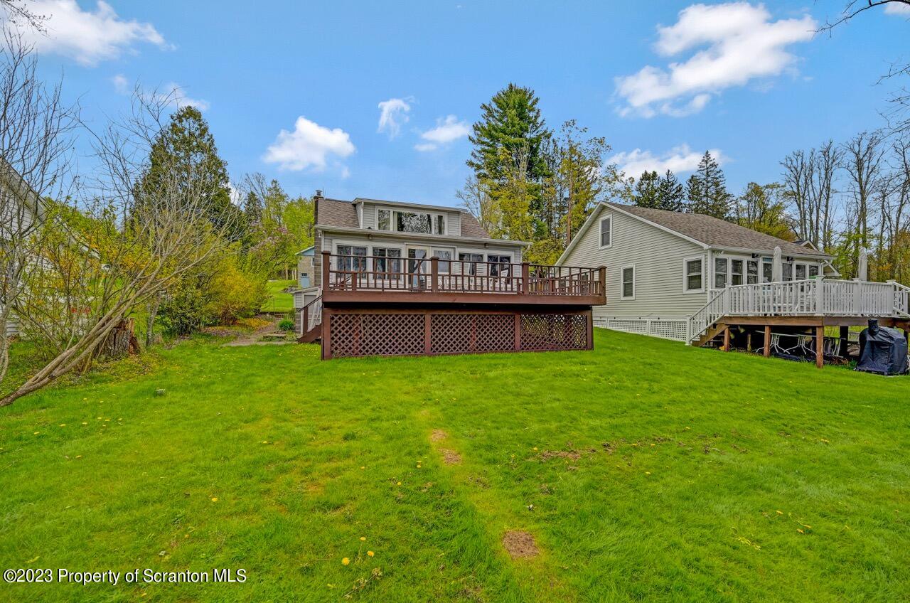 252 Baylor Road Fleetville, PA 18420 - Photo 14 of 50 a view of a house with a backyard