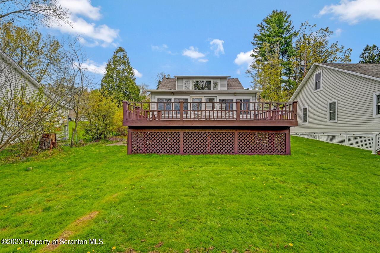 252 Baylor Road Fleetville, PA 18420 - Photo 15 of 50 a view of a house with a garden