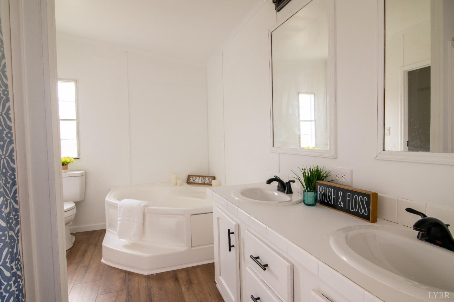 2130 Sandy Ridge Road Nathalie, VA 24577 - Photo 21 of 49 a bathroom with a sink and a toilet