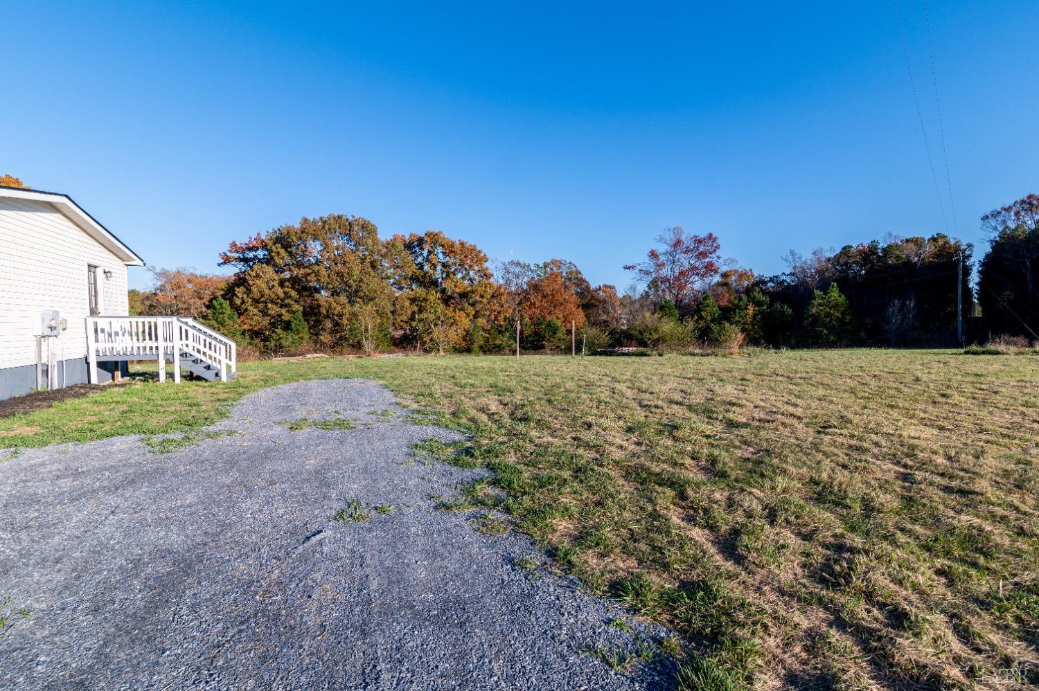 2130 Sandy Ridge Road Nathalie, VA 24577 - Photo 39 of 49 a view of a field with a tree in the background
