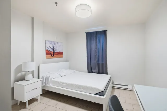 a bedroom with a bed and furniture