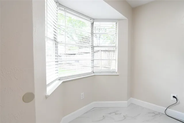 a view of a window in an empty room