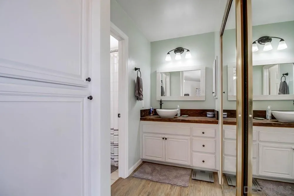 861 Peutz Valley Road Alpine, CA 91901 - Photo 17 of 42 a bathroom with a granite countertop sink mirror and