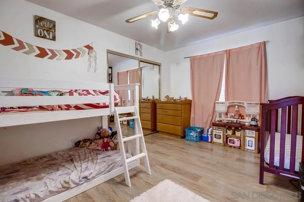 861 Peutz Valley Road Alpine, CA 91901 - Photo 21 of 42 a bedroom with furniture and baby bed
