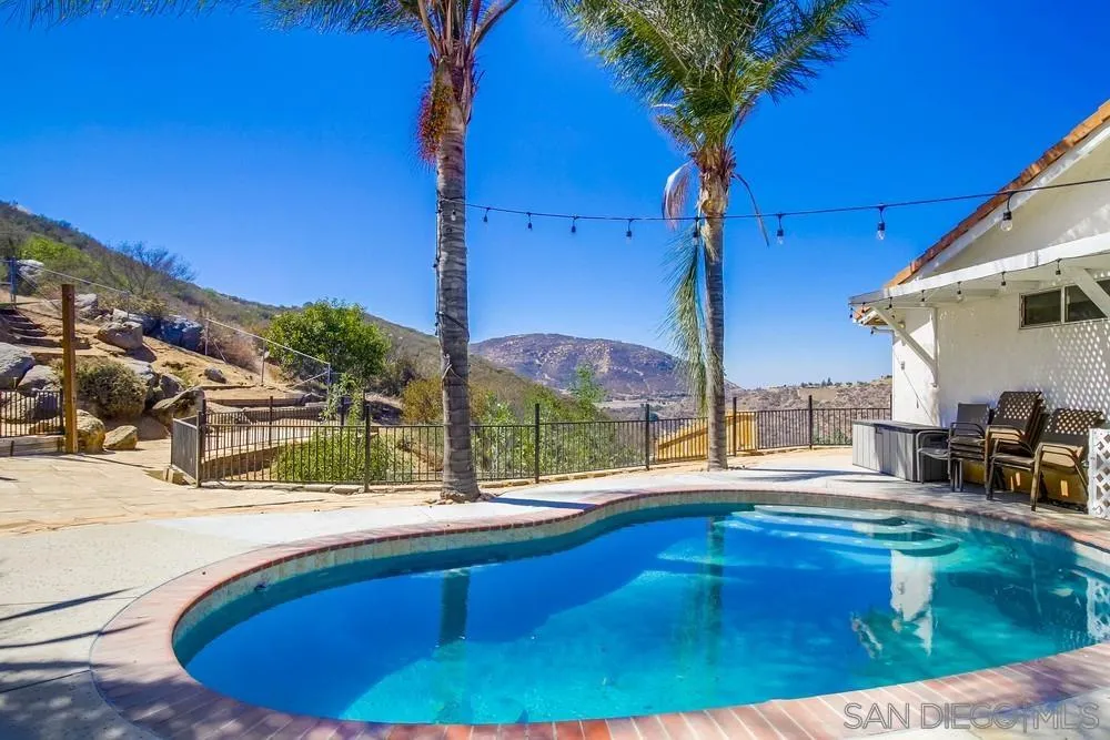 861 Peutz Valley Road Alpine, CA 91901 - Photo 26 of 42 a swimming pool with outdoor seating and yard