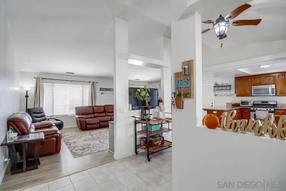 861 Peutz Valley Road Alpine, CA 91901 - Photo 8 of 42 a living room with furniture and a flat screen tv