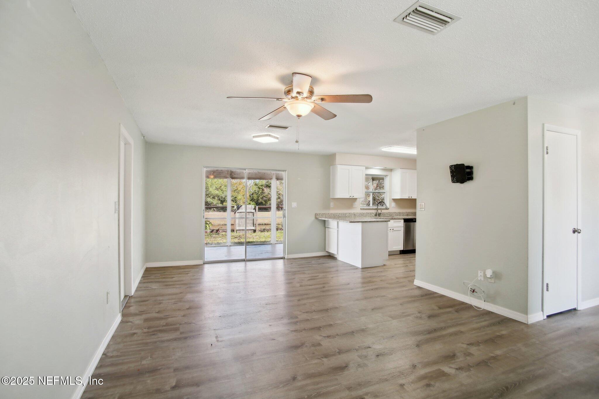 230 Lily Road St. Augustine, FL 32086 - Photo 12 of 39 a view of a kitchen with a sink and a window