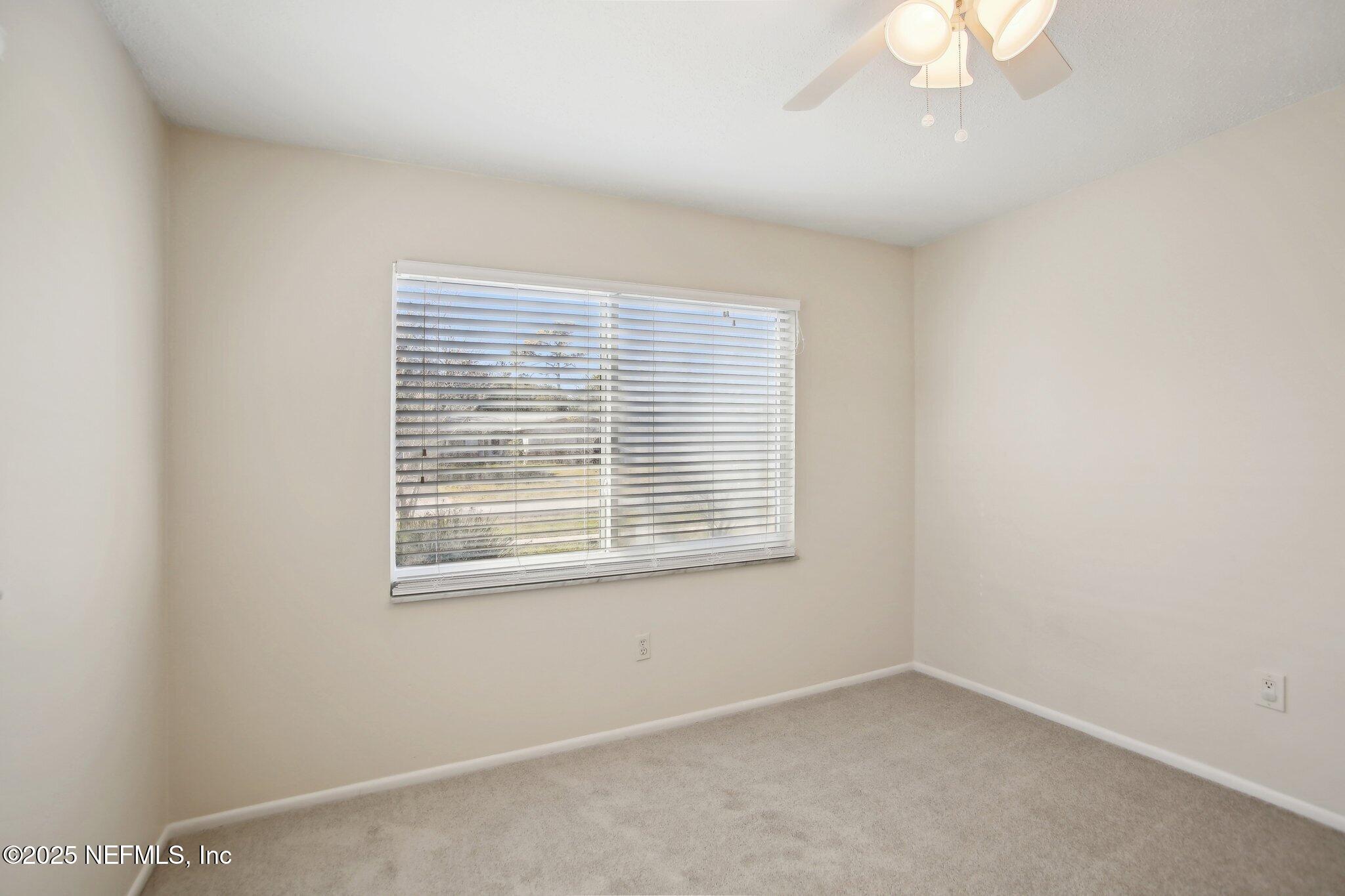 230 Lily Road St. Augustine, FL 32086 - Photo 23 of 39 an empty room with a window