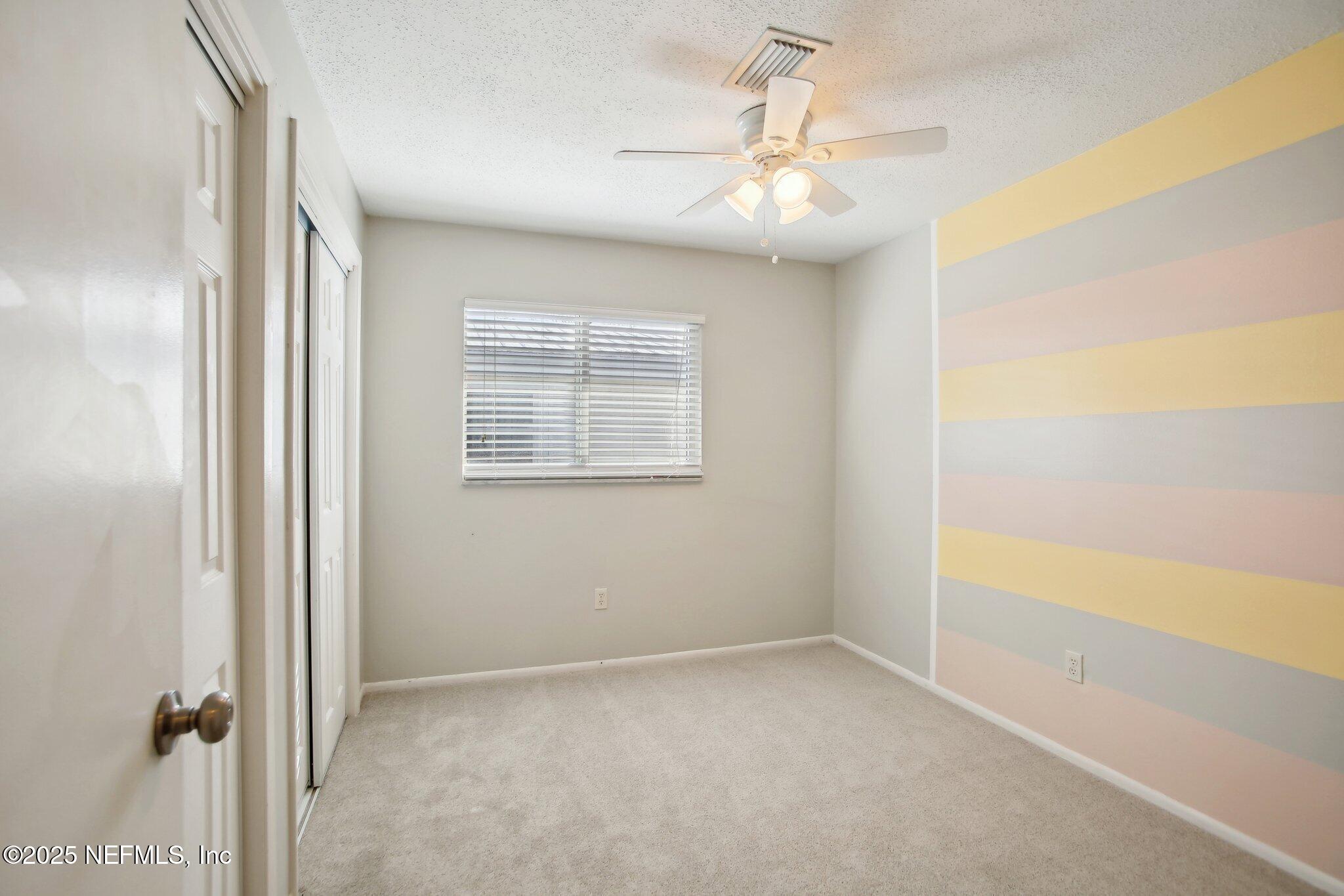 230 Lily Road St. Augustine, FL 32086 - Photo 25 of 39 a view of an empty room with a window