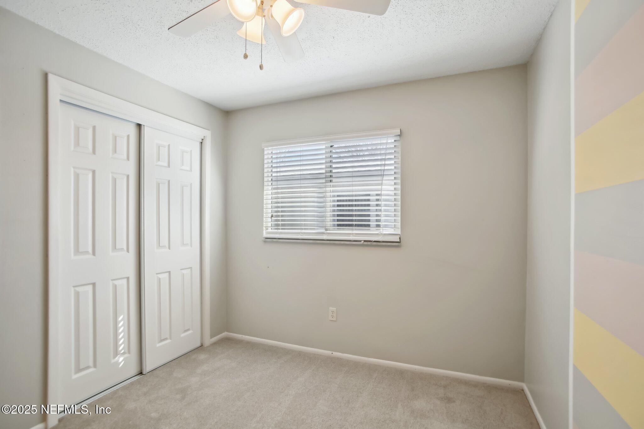 230 Lily Road St. Augustine, FL 32086 - Photo 27 of 39 an empty room with windows