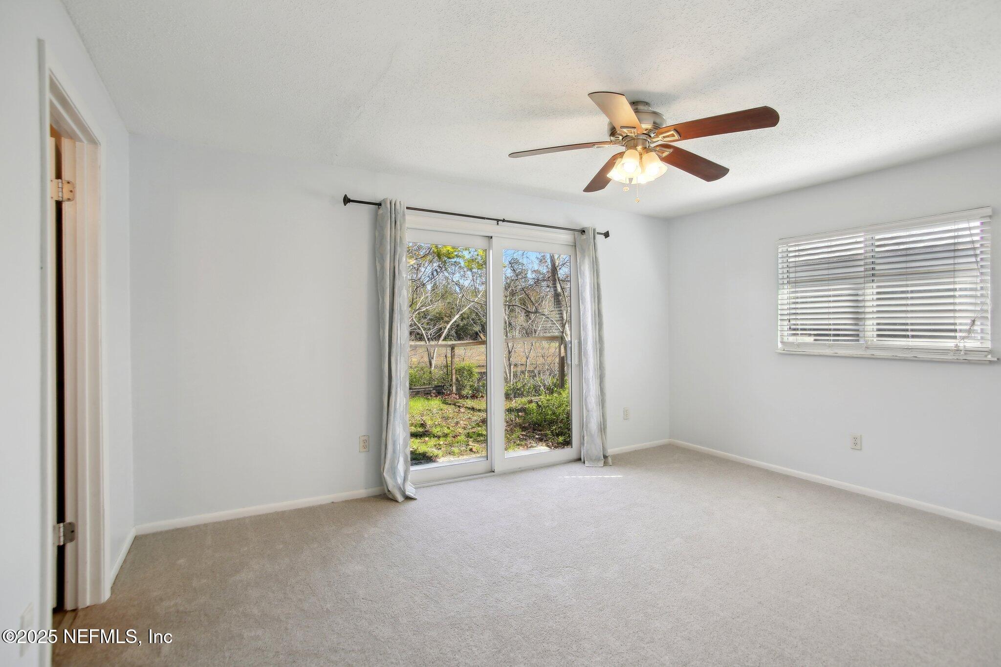 230 Lily Road St. Augustine, FL 32086 - Photo 28 of 39 a view of an empty room with a window