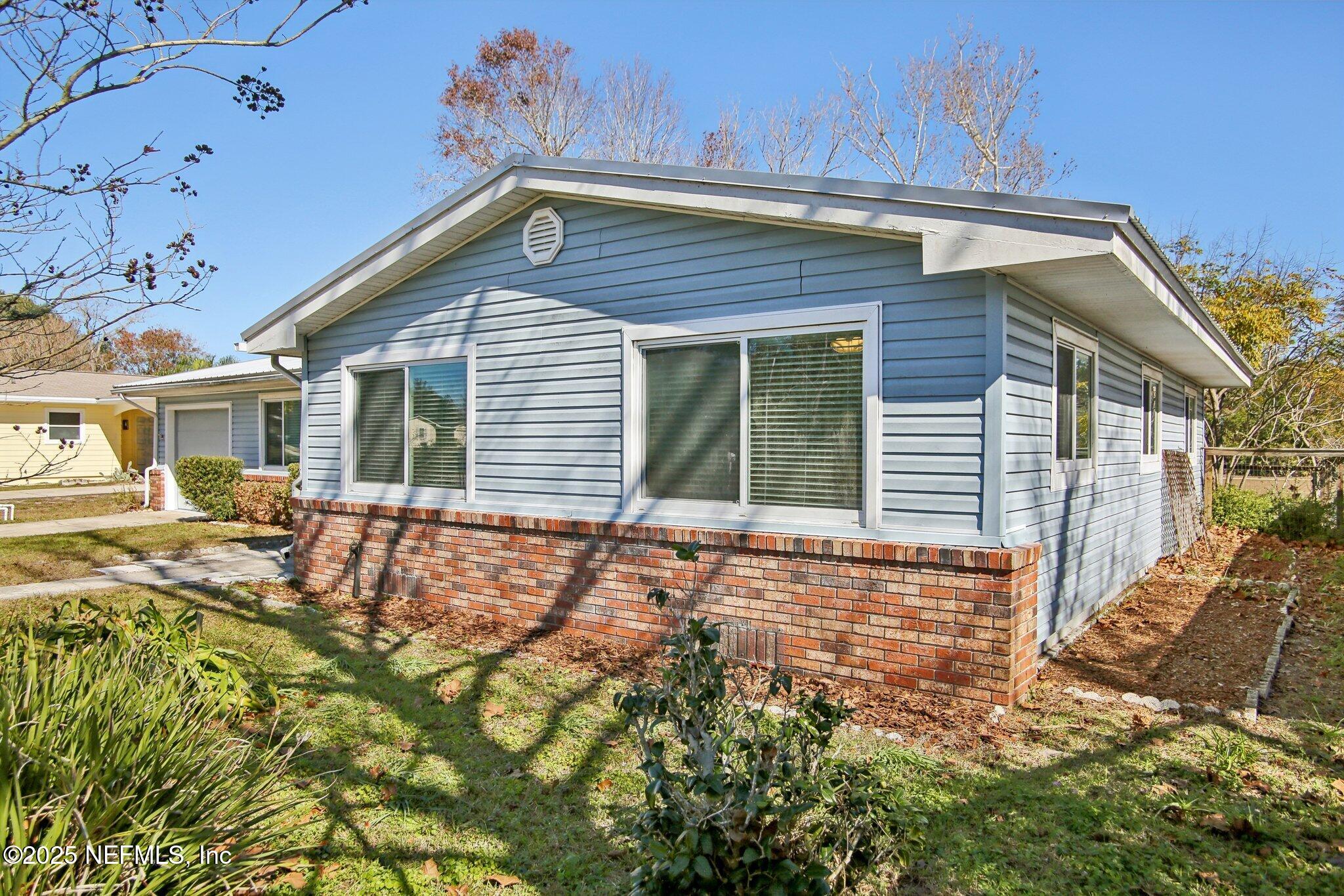 230 Lily Road St. Augustine, FL 32086 - Photo 3 of 39 a view of house with backyard and seating space