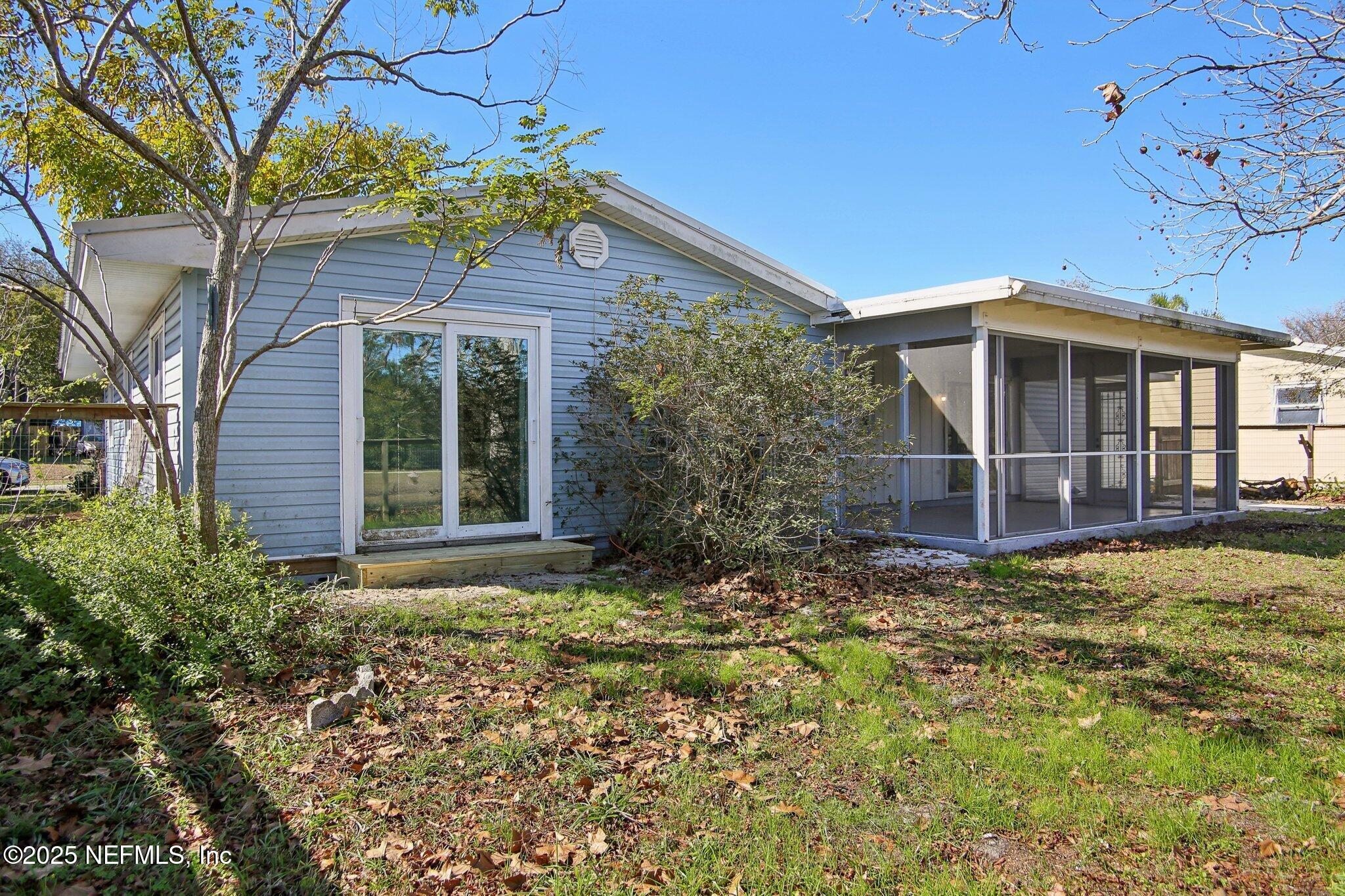 230 Lily Road St. Augustine, FL 32086 - Photo 37 of 39 front view of a house with a yard