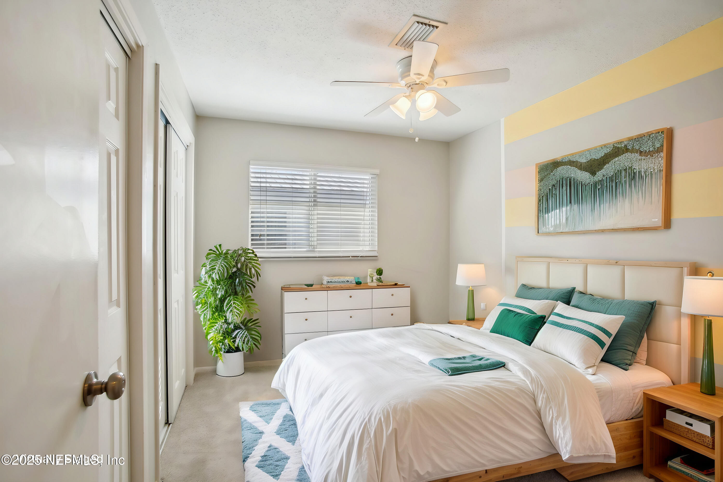 230 Lily Road St. Augustine, FL 32086 - Photo 9 of 39 a bedroom with a bed and a chandelier