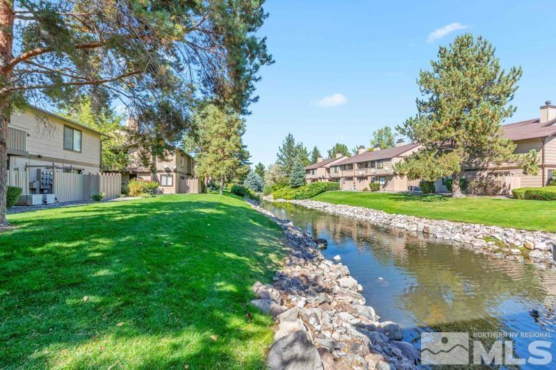 4701 Reggie Road Reno, NV 89502 - Photo 21 of 29 a view of a lake with a building in the background