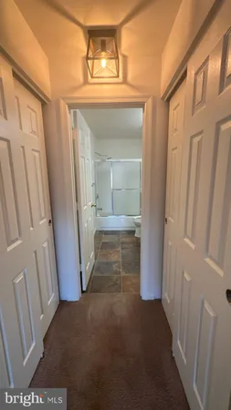a view of a hallway view with staircase